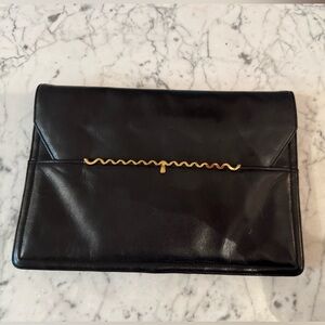 Block vintage clutch, excellent vintage condition. 10x13. Strap tucks inside